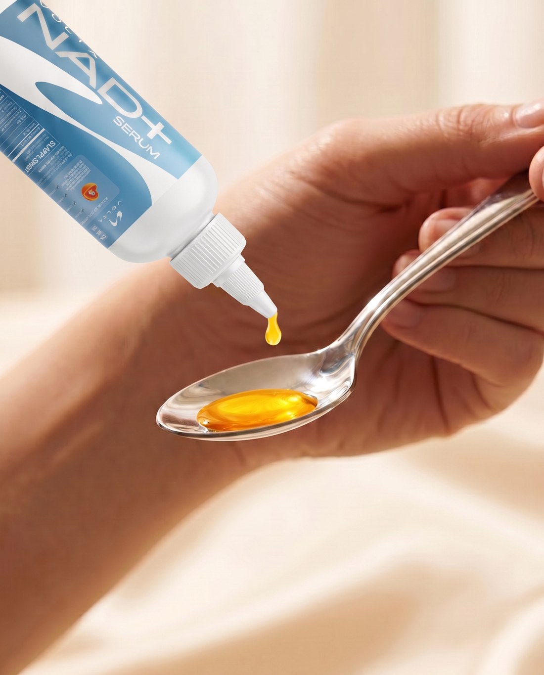 Drop NAD+ vita-serum on a spoon